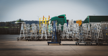 Fleet of delivery equipment (racks) with glass on it
