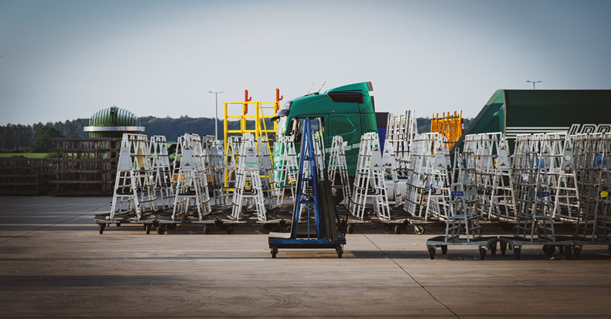 Fleet of delivery equipment (racks) with glass on it